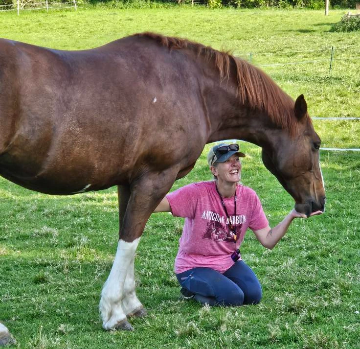 Horse owner Sophia sharing a quiet moment of connection and trust with her horse Patsy in an East Sussex paddock.