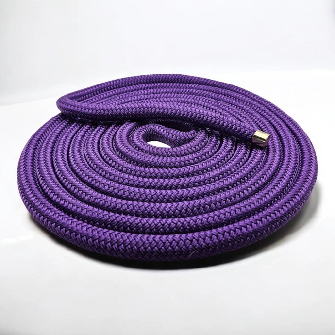 Coiled precision rope for horse groundwork in the Odessa palette—regal deep purple fibers with burnt orange accents for a sophisticated equestrian look.