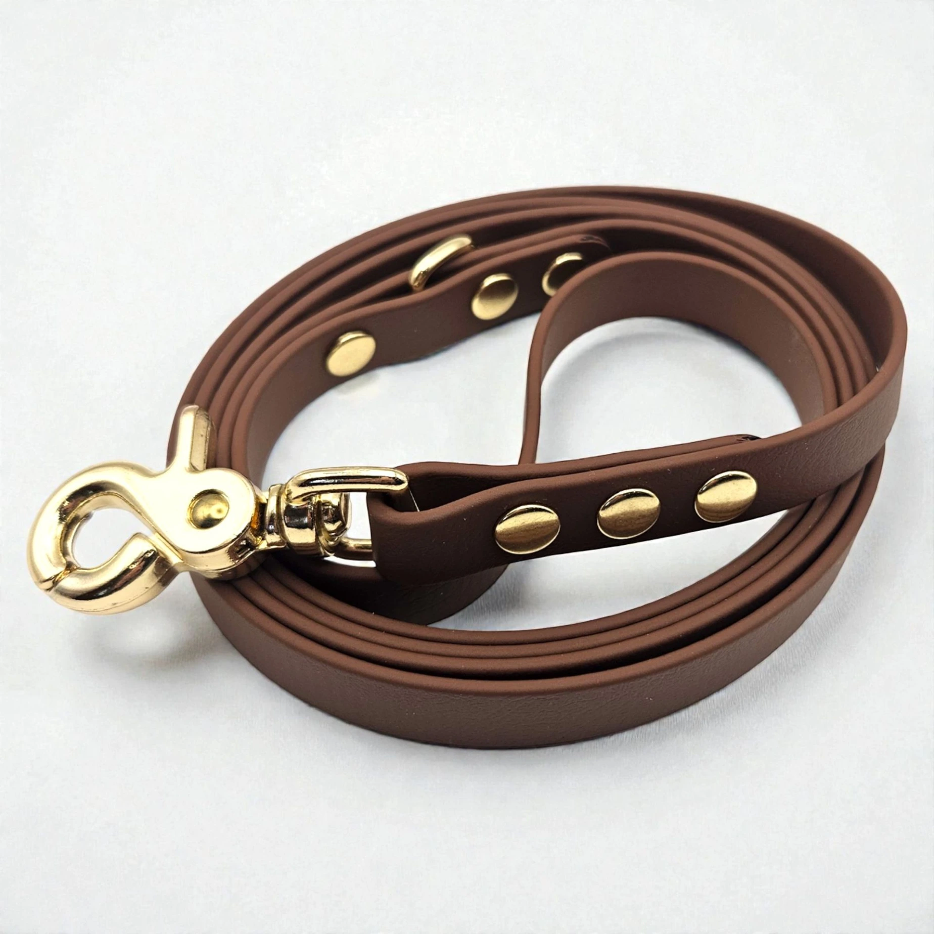 Handcrafted Pioneer Brown waterproof BioThane dog lead featuring premium gold hardware.