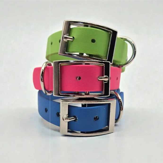 Three handcrafted BioThane® dog collars in green, pink, and blue, each featuring a durable silver buckle and D-ring. Waterproof, stink-proof, easy to clean, and available in bright custom colours. Perfect for stylish, practical pet owners.